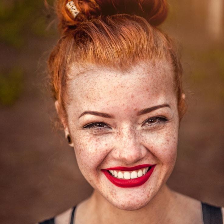 Kaveri Mehta, Lead Design Curator at LodgePaperTrail, reviewing corporate floral arrangements